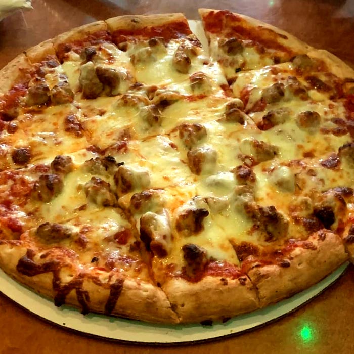 Players Pizza & Pub restaurant and bar in Oshkosh serves the best authentic brick oven sausage and cheese pizzas